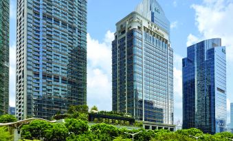 a city with tall buildings and large skyscrapers in the background on one side at The Langham, Shenzhen