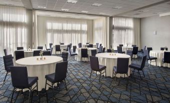 a large conference room with multiple round tables and chairs , all set up for a meeting or event at Courtyard New Carrollton Landover