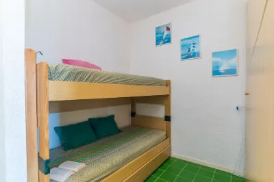 Il Vecchio Faro A48 from the Beach - Happy Rentals