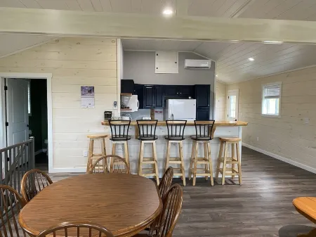 Family friendly cottage, covered deck, close to lake to fish, swim, and boat