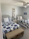 Beautiful End Unit Single Level Condo North Coast Village - Walk to the beach!!