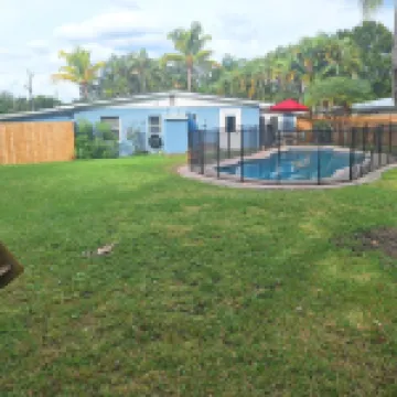 Lagoon shaped pool home with private back yard!