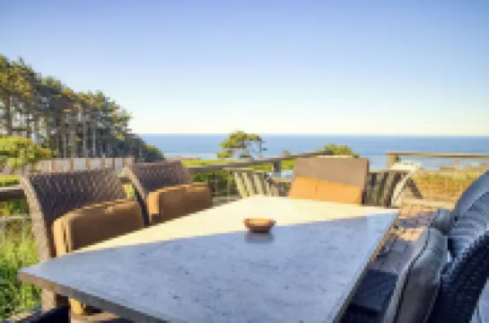 Large beach home with fantastic views of the Oregon Coast with a quaint cabin.
