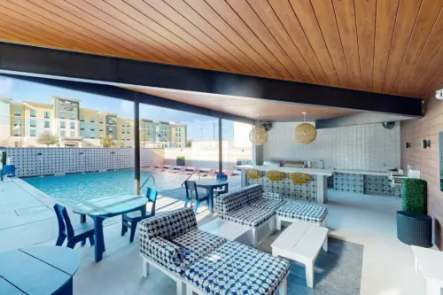 Private Balcony and Stunning Pool Amenities - Elegant Sanctuary