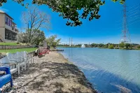 Dog-friendly water view home with inviting porch, AC, W/D, & modern charm