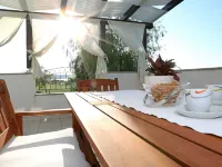 Modern Ground Floor Apartment with Private Terrace Near the Sea