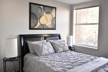 AT YOUR SERVICE! Downtown Aurora 1 Bedroom River Facing Gem