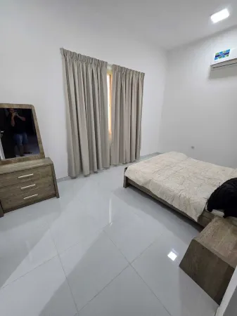 Cozy 1-bedroom room in townhome in amazing Ajman with WiFi, AC