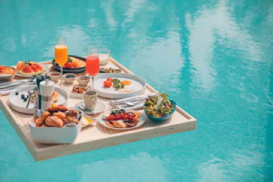 Quest San Hotel Denpasar Bali by Aston Отели рядом с достопримечательностью «Mahendradatta University Bali»