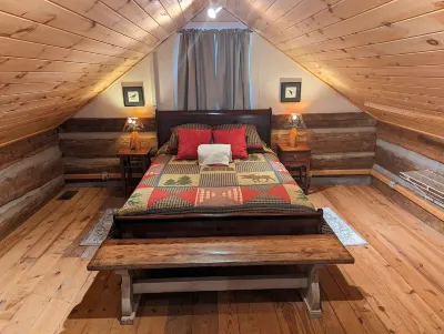 Authentic log cabin nestled in the woods by creek