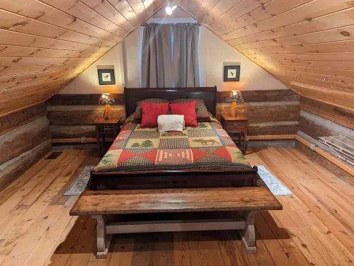 Authentic log cabin nestled in the woods by creek