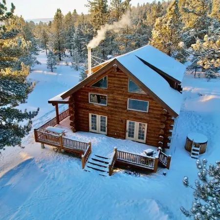 Custom log cabin tucked away in private forest