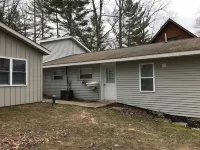 Large waterfront house on quiet canal of all-sport Eight Point Lake