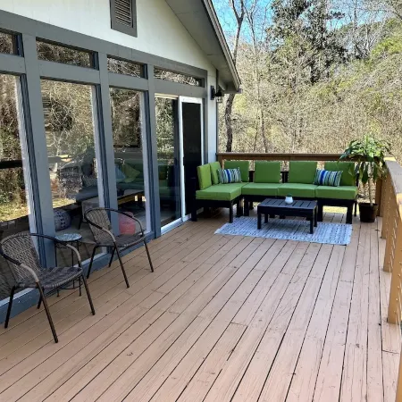 Cozy coastal oasis w/ wooded views and wrap around deck. Close to Dauphin Island