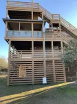4X4 only! Canal front. Ocean AND sound views! Decks and porches on all levels.
