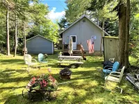 Charming, newly renovated pet-friendly, lake front cottage on Little Wolf Pond! Hotels near The Wild Center