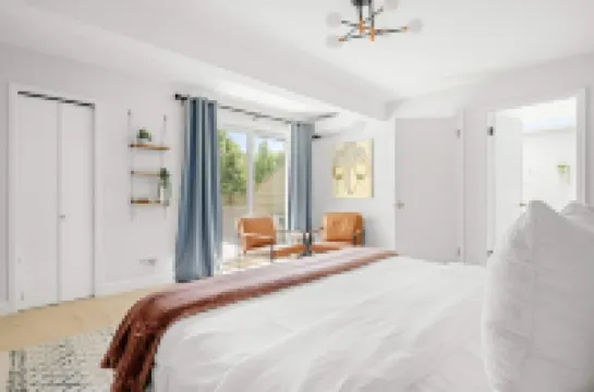 Two Balconies and Seasonal Community Pool - Bright and Airy Retreat