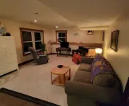 Charming 2-bedroom apartment with outdoor hot tub in rural area, private yard.