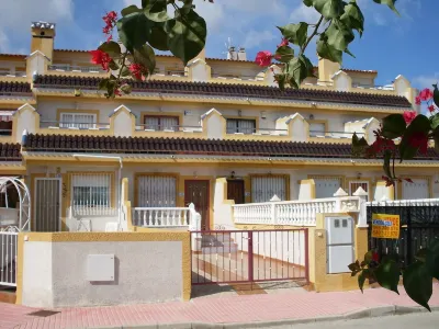 Spacious terraced house for up to six people with communal pool Hotels near Paddy's Point