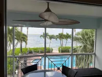 Stunning beachfront condo next to restaurant & a short drive to famous RumPoint