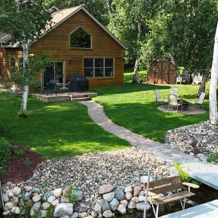 Spacious Summer Escape: Private Backyard, Dock & Fire Pit, Channel Waterfront