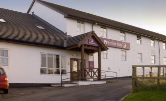 "a white building with a sign that reads "" premier inn "" prominently displayed on the front of the building" at Premier Inn Whitehaven