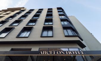 A rendering depicts the front view of an art deco hotel in Hong Kong at Arcelon Hotel