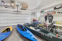 Rainbow Lake home in gated community w/ boats,  hot tub, and private lake access