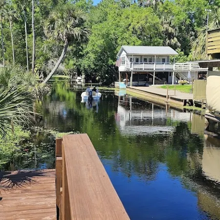 Cozy canal front house with its own boat ramp and dock. Amazing waterfront view.