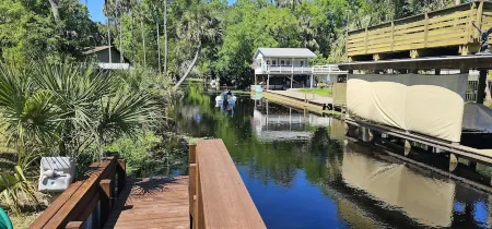 Cozy canal front house with its own boat ramp and dock. Amazing waterfront view.