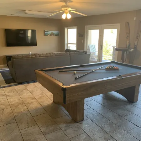 Lakehouse with covered dock, slide, and outdoor kitchen! Close to I-75, trails.