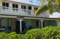 Beachfront one bedroom studio with full kitchen, covered porch and open deck. Hotels in 