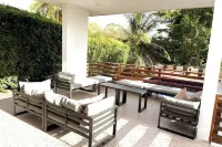 Large modern villa with pool on West Coast near beach & restaurants w/ parking.
