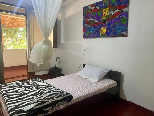 Stylish three bedroom African-themed holiday home! Private baths and kitchen.