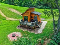 Tiny cabin sits by a bubbling, stocked creek. Pet friendly for a fee, hot tub