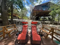 Amazing Jungle Tree House right over the river with bikes and canoe