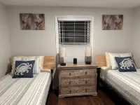 This Two-Bedroom Cottage Features One Queen Bed, Two Twin Beds, and a Sofa Bed.