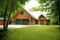 Beautiful log cabin in the woods with a hot tub. 5 min walk to a quiet beach. Hotels in Chippewa County