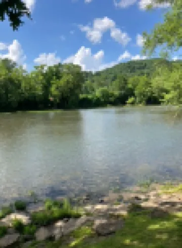 Gound level and private home with 142 feet of river front access.