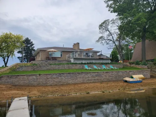 Beautiful Lake House with 150' sandy beach on 85 acre all sports lake