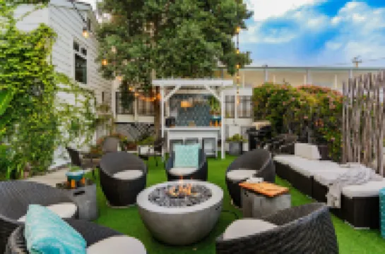 Charming Coastal Retreat with Firepit Lounge - Bright and Inviting Escape