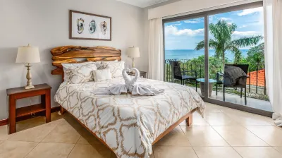 Elegant Oceanview Condo with Spacious Open-Concept Floor Plan and Inviting Beach Design Hotels near Playa Flamingo
