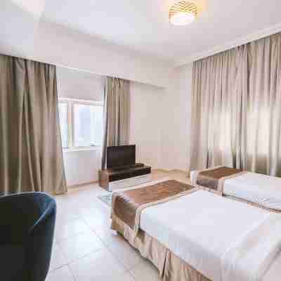 Magnum Hotel & Suites West Bay Rooms