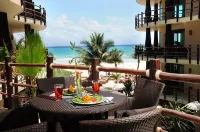 Oceanfront condo on the beach w/ hot tub! Minutes walk to restaurants and bars!