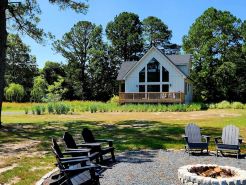 Secluded waterfront getaway with hot tub,fire pit, and private dock.