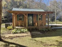 Peaceful cabin in secluded mountain spot beside a picturesque creek