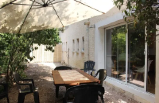 Large garden with swimming pool.