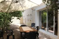 Large garden with swimming pool.