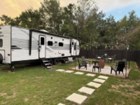 Cozy RV Retreat with Private Hot Tub and Fenced Yard