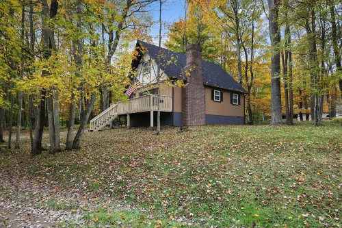 Game Room and Fire Pit Tree-Lined Pocono Lake Cabin - parking